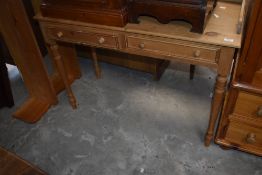 A modern pine washstand with three quarter shaped gallery, two frieze drawers and turned supp0orts