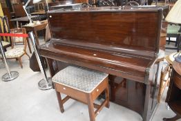 An upright Piano, impressed mark to back 'R & D 4 7 8 2 3', L142cm sold together with piano