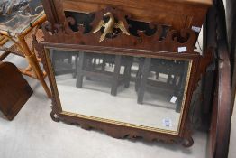 A 19th Century Chippendale style wall mirror having gilt bird decoration, approx. 70 x 60cm