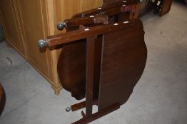 Two pairs of 1940's walnut veneer single bed ends, with casters but lacking rails