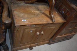 A modern pine two door cupboard 66cm high