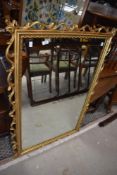 A reproduction wall mirror decorated in the Rococo style, h120cm
