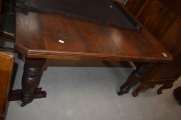 A Victorian mahogany extending wind out dining table , with extra leaf (no winder)