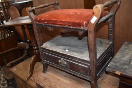 A late Victorian mahogany piano stool with padded and adjustable seat and base drawer 61cm seat