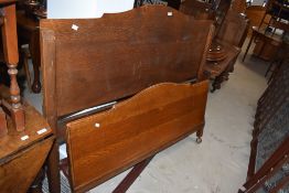 A 20th century oak bed frame, w138cm A/F