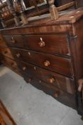 A 19th century mahogany chest of 2/3 drawers with turned knob handles and reeded ends on bracket