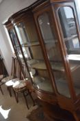 An Edwardian dispplay cabinet having bowed centre section, width approx. 122cm
