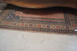 A North West Persian prayer rug with tasselled ends 106cm x 60cm