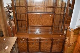 A 1980's burr-wood veneer/effect room unit with an arrangement of drawers, cupboard doors and