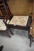 A vintage piano stool having upholstered floral seat, seat h53cm x 57cm overall