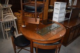 A Mid-Century G-Plan 'Fresco' circular dining table, closed w122cm, sold together with four chairs