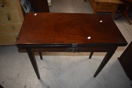 An Georgian mahogany fold over tea table, of traditional design 73cm x 89cm x 44cm