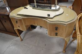 A kidney shaped vintage dressing table in the Queen Ann style, L125cm