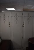 A white finished Olympus continental style triple wardrobe