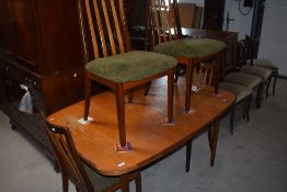 A 1960's/70's teak G-Plan extending dining table and four chairs 72cm x 144cm x 92cm