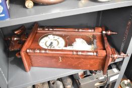 A 31 day mahogany cased wall clock, L70cm