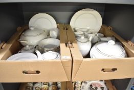 A Harmony fine bone china part dinner service, decorated with gold colour edge and border on a white