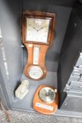 A Smith oak cased 8-day combinationwall clock, having temperature and barometer gauge, 50cm, sold