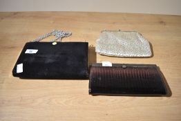 Three vintage ladies clutch bags.
