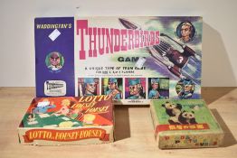 Three vintage toys including the Thunderbirds game, Lotto Housey Housey and a Panda Picture Cubes