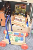 A selection of vintage toys including a push along trolley holding letter blocks, a small fuse
