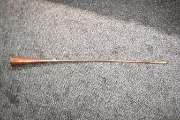 A 20th century copper and brass hunting horn, L120cm Condition report: Damaged