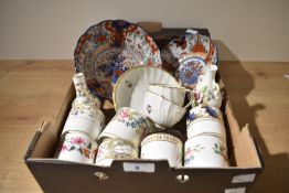 Two Crown Derby saucers a cup and a matching bowl having embossed leaf design with gilt edging and