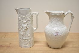 A Tiverton Cobridge pottery pitcher in the Art Nouveau style decorated with floral patterns, h20.