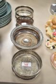 4 silver plated bottle coasters, largest w15cm