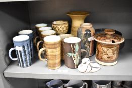 A group of 4 Cinque Ports pottery cups, h12cm, sold together with an Isle of Arran duck ect