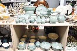 A large Denby Stoneware dinner service in green glaze, to include tureen, pitcher and egg cups ect
