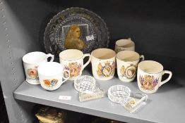 A selection of commemorative china cups and glass wares