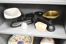 Two vintage cast-metal kitchen scales and weights