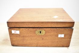 A early 20th century writing slope having brass handles and key hole, w59cm