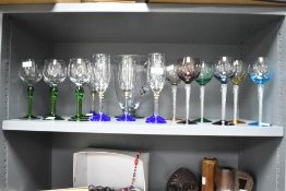 A selection of decorative drinking glasses including colour and twist stem