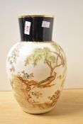 A Crown Albion ceramic vase of baluster form decorated with exotic birds and floral patterns, makers
