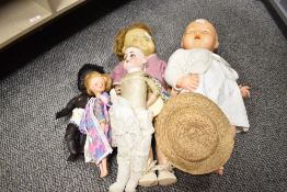 A quantity of plastic dolls, to include a black doll ect
