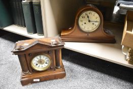 A late 19th or early 20th Century mahogany cased mantel clock of architectural form having enamelled