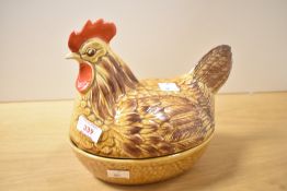 A Price Kensington pottery hen on nest, of typical form and design 20.5cm