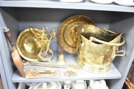 A brass coal helmet of traditional deisgn, sold along with a selection of other brass wares