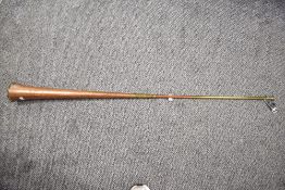 A cooper and brass coaching horn, of typical form 123cm high