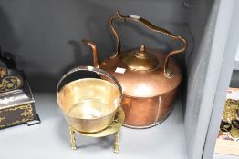 A 19th / 20th century copper kettle having shaped handle and spout, h29cm, sold together with a