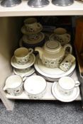 A Hornsea dinner service having floral patterns on a cream glaze ground, to include tea pot, cups