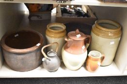 A collection of salt glazed jugs and jars