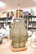 An interesting Chinese cast-bronze vessel of archaic design, having patinated finish, later
