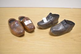 A pair of 19th Century childrens clogs and a later treen pair of decorative clogs