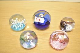 A Caithness 'Mooncrystal' pattern glass paperweight, h5cm, sold together with four similar