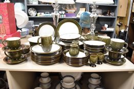 An attractive Denby dinner service having a green glaze ground, to include soup bowl, cups and