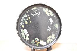 A black tray having floral patterns, w25.5cm