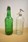 A 20th century glass Hooper Struve bottle, h32cm, sold together with a green glass Groloch